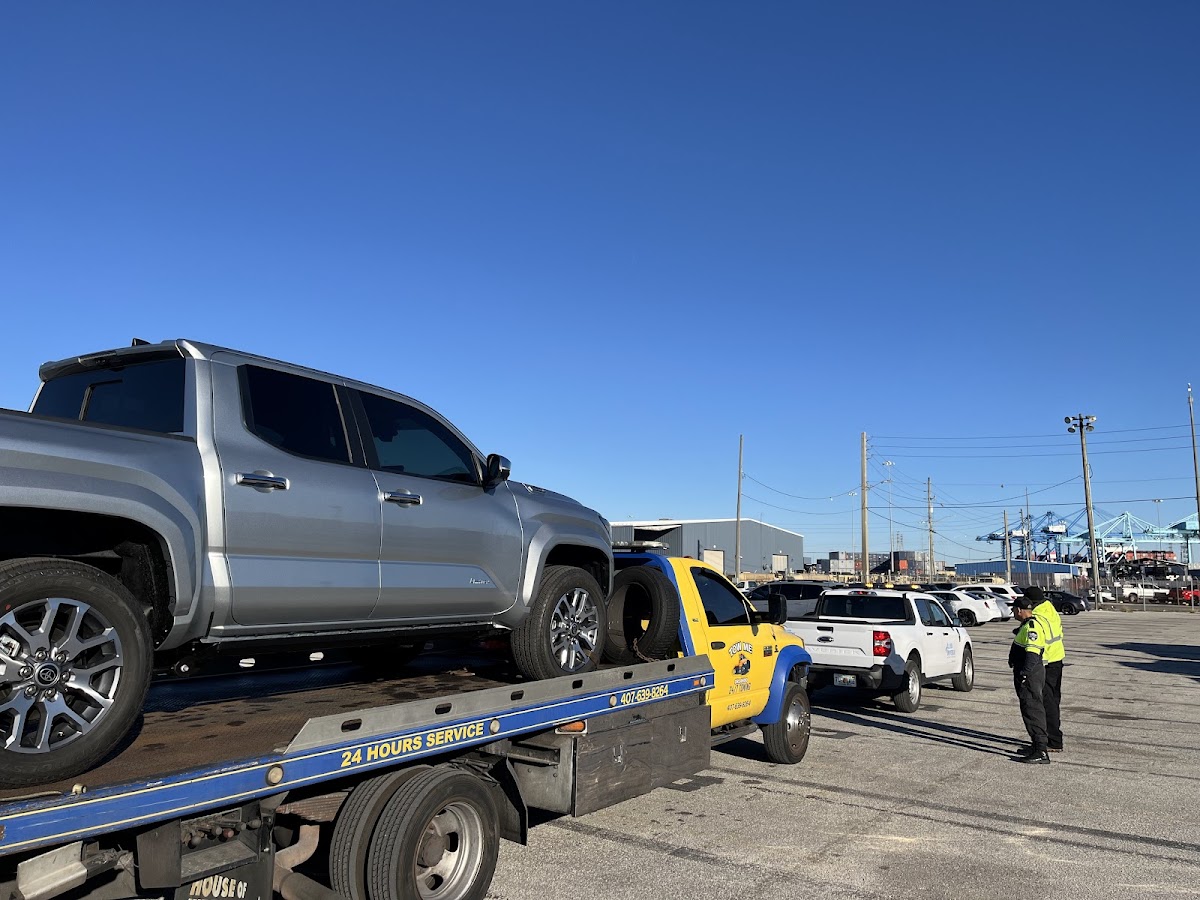 Driver in hi-vis vest loading a vehicle